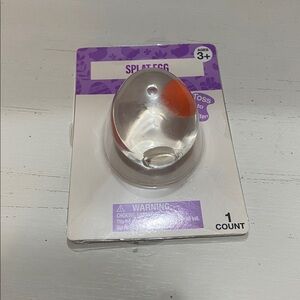Splat Egg Toy - Clear Shell with Orange Center